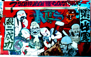 "7 Samurai from the Far Eastside" rooftop mural for the DADA 1997 annual art show.  Mural features street artists SLICK, TEMPT, HYDE, RELIC, DUKE, PRIME, and SKEPT with calligraphic graffiti by Chaz Bojórquez. Photograph by Ben Higa